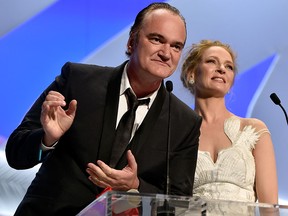 Quentin Tarantino and Uma Thurman appear on stage to give the Palme d'Or award during the closing ceremony at the 67th Annual Cannes Film Festival on May 24, 2014 in Cannes, France.  (Pascal Le Segretain/Getty Images)