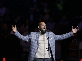 FILE - In this Nov. 17, 2015 file photo,  R. Kelly performs the national anthem before an NBA basketball game between the Brooklyn Nets and the Atlanta Hawks in New York.