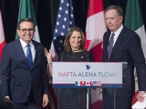 Foreign Affairs Minister Chrystia Freeland leaves the stage with U.S. Trade Representative Robert Lighthizer, right, and Mexico's Secretary of Economy Ildefonso Guajardo Villarreal after delivering statements to the media during the sixth round of negotiations for a new North American Free Trade Agreement in Montreal on Jan. 29, 2018.