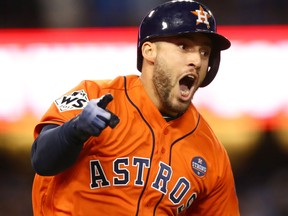 George Springer of the Houston Astros celebrates after hitting a two-run home run during the second inning against the Los Angeles Dodgers in game seven of the 2017 World Series at Dodger Stadium on Nov. 1, 2017