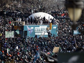 Fans cheer as a bus with team members arrives near the Philadelphia Museum of Art during a Super Bowl victory parade for the Philadelphia Eagles football team, Thursday, Feb. 8, 2018, in Philadelphia. The Eagles beat the New England Patriots 41-33 in Super Bowl 52.