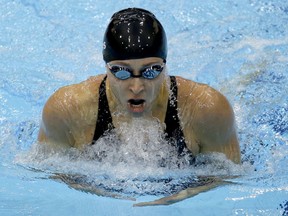 In this July 30, 2012, file photo, American swimmer Ariana Kukors competes in a women's 200-mette individual medley heat at the Aquatics Centre in the Olympic Park during the Summer Olympics in London.