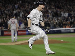 New York Yankees' Todd Frazier reacts after hitting a home run during Game 3 of the American League Championship Series against the Houston Astros Monday, Oct. 16, 2017, in New York. (AP Photo/David J. Phillip)