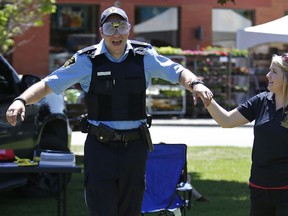 A police officer tries to walk a straight line wearing fatal vision glasses with simulated levels of intoxication. The Canadian Forces is purchasing similar goggles for its supervisor training courses.