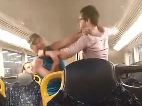A viral video depicts two men brawling on an Australian train. The fight ended with a bro hug. (Facebook)