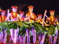 Dancers perform a traditional hula kahiko dance at the new Ka Wa'A Luau at Disney's Aulani Resort in Ko Olina, west of Honolulu.