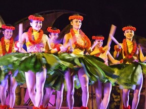 Dancers perform a traditional hula kahiko dance at the new Ka Wa'A Luau at Disney's Aulani Resort in Ko Olina, west of Honolulu.