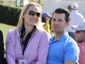 In this March 6, 2016 file photo, Donald Trump Jr. and his wife Vanessa ride in a golf cart during the final round of the Cadillac Championship golf tournament, in Doral, Fla.