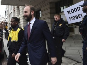 Rick Gates leaves federal court in Washington, Friday, Feb. 23, 2018.