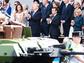 (FILES) In this file photograph taken on July 14, 2017, shows (Bottom row R/L) French President and Senate President Gerard Larcher, wife of French President Brigitte Macron, French President Emmanuel Macron, US President Donald Trump and US First Lady Melania Trump as they attend the annual Bastille Day military parade on the Champs-Elysees avenue in Paris. US President Trump has asked for a military parade to showcase US muscle and underscore his role as commander-in-chief, the White House said February 6, 2018. Trump, who has toyed with the idea of a parade in Washington since before being sworn in, has made the request to officers, who are looking for a date. / AFP PHOTO / joel SAGETJOEL SAGET/AFP/Getty Images