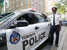 In this file photo, Toronto Police Chief Mark Saunders unveils the new design for police cars following public consultation on Monday August 21, 2017.