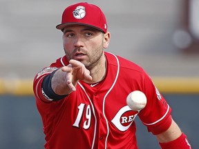 Cincinnati Reds first baseman Joey Votto tosses the ball at the Reds spring training facility Friday, Feb. 17, 2017, in Goodyear, Ariz. (AP Photo/Ross D. Franklin)
