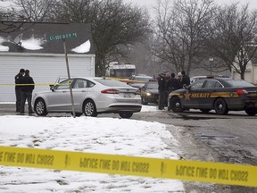 Police investigate the scene of a shooting in Westerville, Ohio, on Saturday, Feb. 10, 2018. Westerville police have confirmed that two officers have been fatally shot at a home in the Columbus suburb. (Tom Dodge/The Columbus Dispatch via AP)