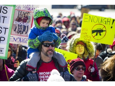 March For Our Lives Ottawa started on Parliament Hill Saturday March 24, 2018, making its way over to Major's Hill Park. People of Ottawa took to the streets joining with others all over North America to demand lives and safety become a priority and to end gun violence and mass shootings in schools.  Four-year-old Felix Stewart-Troy took part in the march, sitting on his father Alex Lovell-Troy's shoulders.   Ashley Fraser/Postmedia