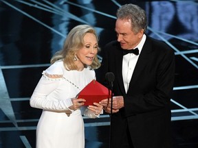 Actors Faye Dunaway (L) and Warren Beatty speak onstage during the 89th Annual Academy Awards at Hollywood & Highland Center on February 26, 2017 in Hollywood, California.