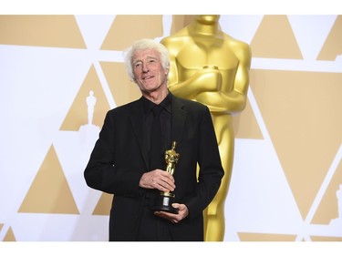 Roger Deakins, winner of the award for best cinematography for "Blade Runner 2049", poses in the press room at the Oscars on Sunday, March 4, 2018, at the Dolby Theatre in Los Angeles.