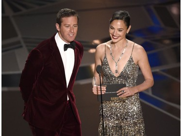 Armie Hammer, left, and Gal Gadot present the award for best makeup and hairstyling at the Oscars on Sunday, March 4, 2018, at the Dolby Theatre in Los Angeles.