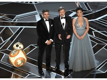 BB-8, from left, Oscar Isaacs, Mark Hamill and Kelly Marie Tran present the award for best animated short at the Oscars on Sunday, March 4, 2018, at the Dolby Theatre in Los Angeles.