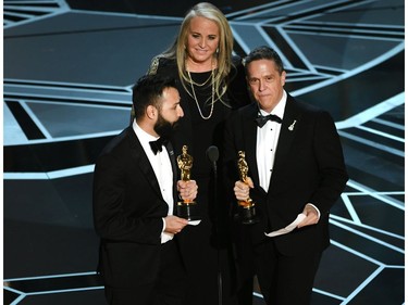 (L-R) Filmmakers Adrian Molina, Darla K. Anderson and Lee Unkrich accept Best Animated Feature Film for 'Coco' onstage during the 90th Annual Academy Awards at the Dolby Theatre at Hollywood & Highland Center on March 4, 2018 in Hollywood, California.