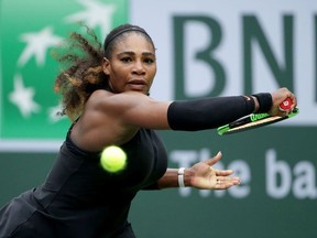 Serena Williams lunges to return a backhand to Kiki Bertens of the Netherlands during the BNP Paribas Open on March 10, 2018 at the Indian Wells Tennis Garden in Indian Wells, California.