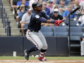 Atlanta Braves prospect Ronald Acuna watches after hitting a home run during a spring training game against the New York Yankees, Friday, March 2, 2018, in Tampa, Fla. (AP Photo/Lynne Sladky)