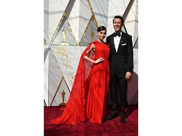 US actress Sofia Carson and US entertainment reporter Ben Lyons arrive for the 90th Annual Academy Awards on March 4, 2018, in Hollywood, California.
