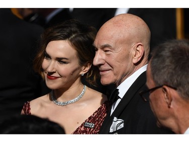 British actor Patrick Stewart (R) and his wife US singer Sunny Ozell arrive for the 90th Annual Academy Awards on March 4, 2018, in Hollywood, California.