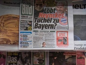 Springer-owned newspapers are on display during German media giant Axel Springer's annual results press conference on March 8, 2018 in Berlin. Axel Springer, owner of the top-selling Bild newspaper, said its thriving digital publishing business would again drive profits in 2018, after a strong performance last year.