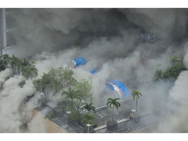 Heavy smoke engulfs the pool side of the Waterfront Manila Pavilion building, a hotel and casino complex, after a fire broke out in Manila on March 18, 2018. (TED ALJIBE/AFP/Getty Images)