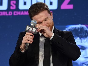 Boxer Canelo Alvarez laughs during a news conference with Gennady Golovkin to announce their rematch during a news conference at Microsoft Theater at L.A. Live on February 27, 2018 in Los Angeles, California. (Photo by Kevork Djansezian/Getty Images)