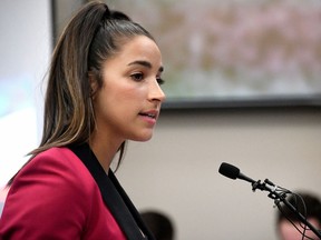 In this Jan. 19, 2018, file photo, Olympic gold medalist Aly Raisman gives her victim impact statement in Lansing, Mich., during the fourth day of sentencing for former sports doctor Larry Nassar, who pled guilty to multiple counts of sexual assault