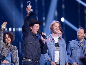 Arcade Fire celebrates their Juno for Album of the Year at the Juno Awards in Vancouver, Sunday, March, 25, 2018.