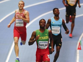 Grenada's Bralon Taplin, centre front, leads in a men's 400-metre heat at the World Athletics Indoor Championships in Birmingham, Britain, Friday, March 2, 2018. (AP Photo/Alastair Grant)