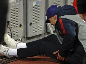 A ball boy sits down after being pushed by a Shakhtar player during a Champions League match between Roma and Shakhtar Donetsk, at the Rome Olympic stadium, Tuesday, March 13, 2018. (AP Photo/Gregorio Borgia)