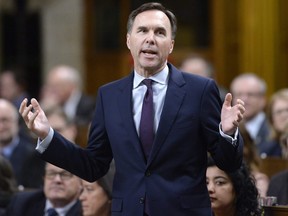 Minister of Finance Bill Morneau rises during Question Period in the House of Commons on Parliament Hill in Ottawa on Thursday, March 1, 2018.