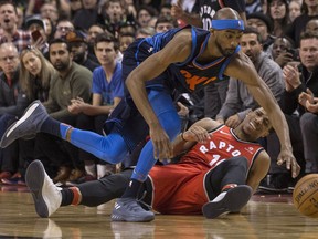 Thunder’s Corey Brewer (left) battles for a loose ball with the Raptors’ DeMar DeRozan during second half at the ACC. THE CANADIAN PRESS/Chris Young