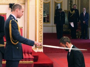 Former Beatle Ringo Starr, is made a knight by Britain's Prince William at Buckingham Palace during an Investiture ceremony in London Tuesday March 20, 2018.
