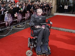 In this March 30, 2015 file photo, Professor Stephen Hawking poses for photographers upon arrival for the Interstellar Live show at the Royal Albert Hall in central London. Hawking, whose brilliant mind ranged across time and space though his body was paralyzed by disease, has died, a family spokesman said early Wednesday, March 14, 2018.