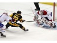 Montreal Canadiens goaltender Antti Niemi (37) stops a shot by Pittsburgh Penguins' Patric Hornqvist (72) with Charles Hudon, left, defending during the first period of an NHL hockey game in Pittsburgh, Saturday, March 31, 2018.