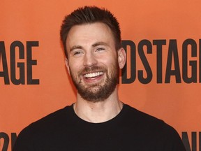 FILE - In this Feb. 16, 2018 file photo, Chris Evans attends the "Lobby Hero" Broadway press meet and greet at Sardi's in New York. Evans tells The New York Times he has no plans to return to the Marvel movie franchise as Captain America after reshoots of the fourth "Avengers" movie later this year. Evans says "you want to get off the train before they push you off." The movie has yet to be titled and is expected to be released in 2019.