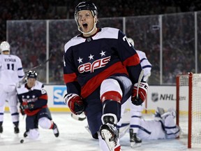 John Carlson of the Washington Capitals celebrates his goal against the Toronto Maple Leafs during a Stadium Series game at Navy-Marine Corps Memorial Stadium on March 3, 2018