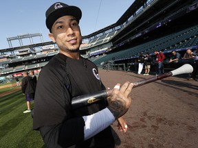 In this Sept. 29, 2017, file photo, Colorado Rockies right fielder Carlos Gonzalez heads back to the dugout after warming up in Denver. (AP Photo/David Zalubowski, File)