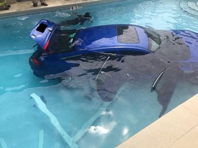 A mom in Florida thought she put the car in park when she went back into the apartment to get some money. The car, with her husband and daughter inside, crashed through a gate and ended up in a swimming pool. (Okaloosa County Sheriff's Office)
