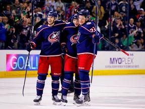Markus Nutivaara of the Columbus Blue Jackets is congratulated by Oliver Bjorkstrand and Sonny Milano after scoring against the Ottawa Senators on March 17, 2018