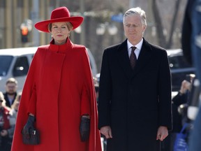 King Philippe and Queen Mathilde of Belgium stand at a wreath laying ceremony at the Tomb of the Unknown soldier at the at the National War Memorial in Ottawa on Monday, March 12, 2018.