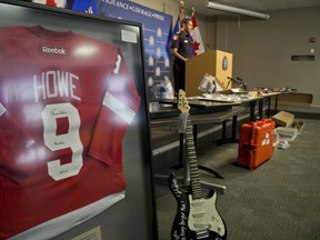 Calgary police display a signed Gordie Howe jersey and other stolen memorabilia at a press conference on Tuesday, March 20, 2018. The items were seized in a drug bust.