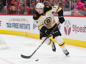 In this Feb. 6, 2018, file photo, Boston Bruins defenceman Charlie McAvoy skates with the puck in the second period of an NHL hockey game against the Detroit Red Wings in Detroit