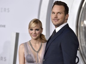FILE- In this Dec. 14, 2016, file photo, Chris Pratt, right, and Anna Faris arrive at the Los Angeles premiere of "Passengers"at the Village Theatre Westwood.