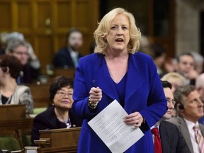 Conservative MP Lisa Raitt stands during question period ion the House of Commons on Parliament Hill in Ottawa on Wednesday, March 28, 2018.