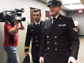 A military judge is expected to render a decision today in the case of a Halifax sailor accused of sexually assaulting a subordinate. Accused Master Seaman Daniel Cooper, right, arrives for his standing court martial case in Halifax on Tuesday Sept. 26, 2017. Cooper faces one charge of sexual assault, and one charge of ill treatment of a subordinate, arising out of incidents that allegedly occurred in November 2015 on board HMCS Athabaskan near Rota, Spain.